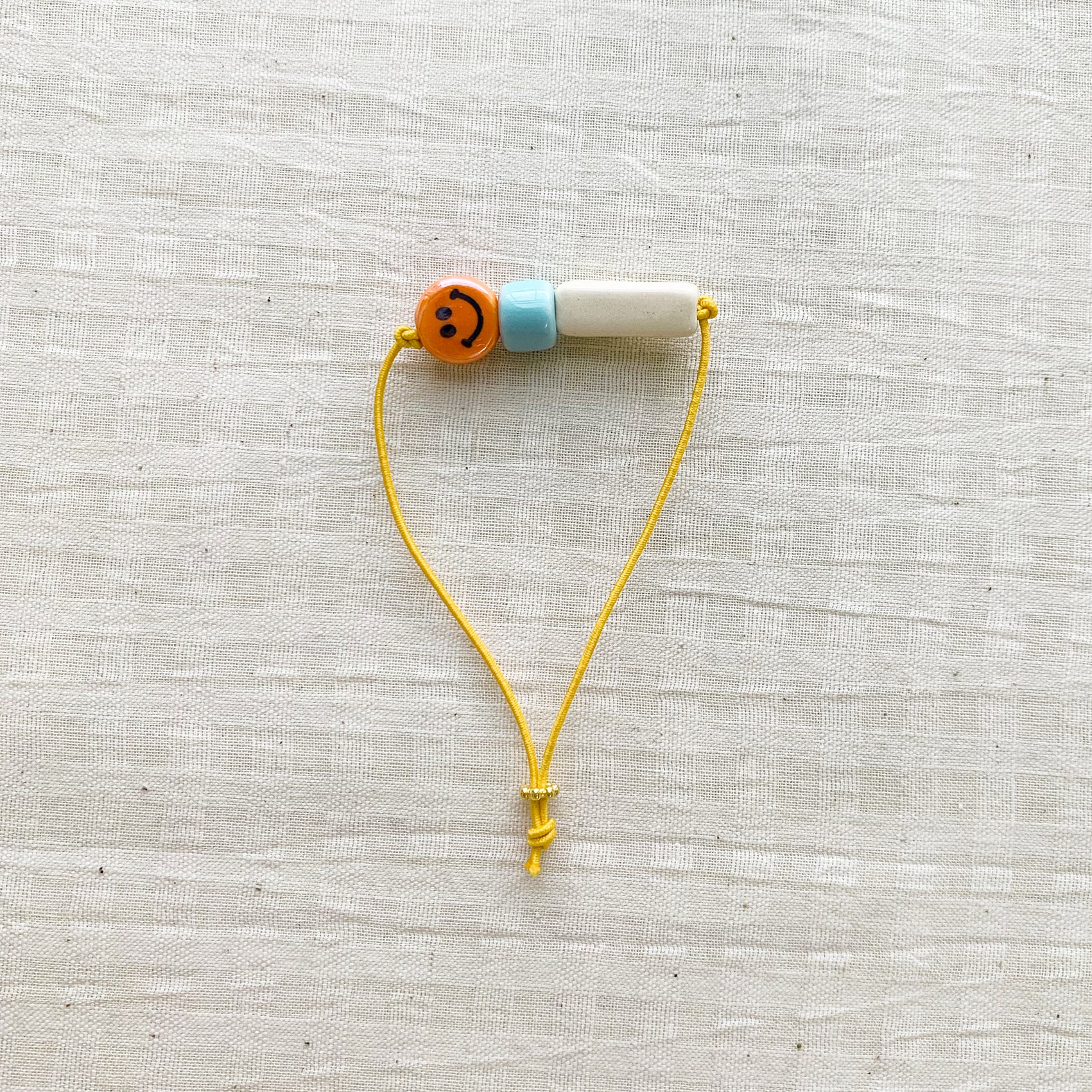 Happy Bracelet - Orange Smiley
