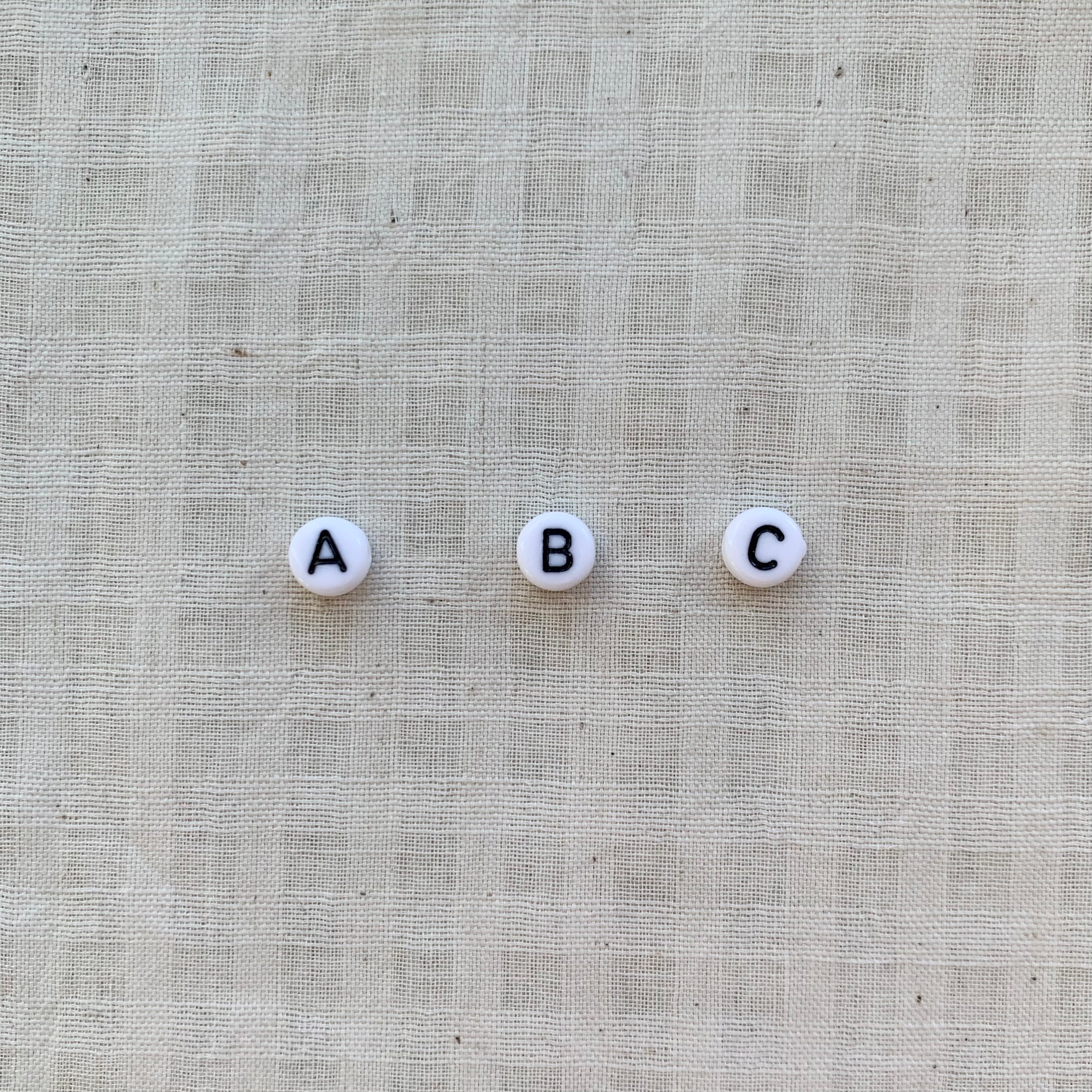 All White Pebbles with Initial Letter